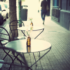 neighborhood cafe with bistro tables on sidewalk