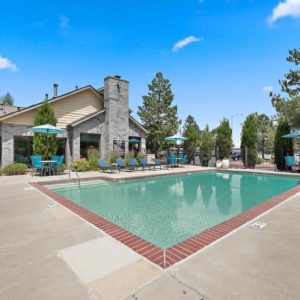 open pool deck with lounge furniture and seating areas near the clubhouse