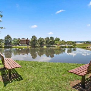 Community lake with rockies in the background